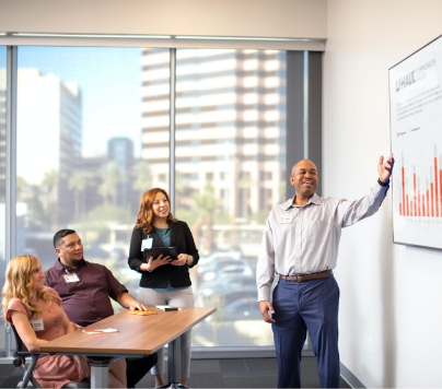 Instructor giving a presentation on a white board