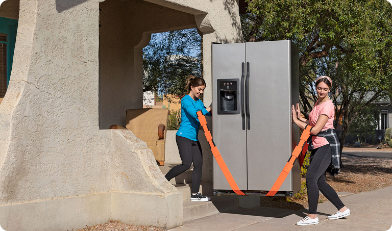 Two women moving a refrigerator with a U-Haul Moving Harness
