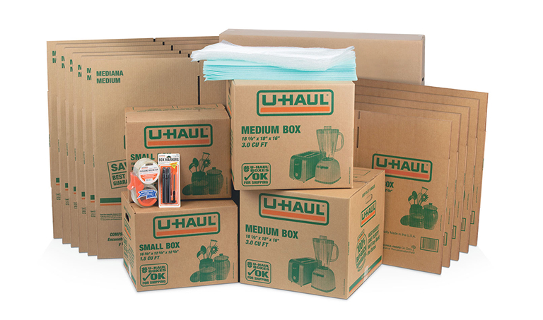 U-Haul moving supplies including small and medium boxes, packing paper, and tape