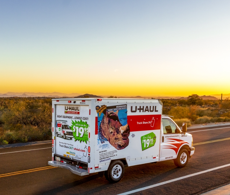 U-Haul truck driving into the sunset