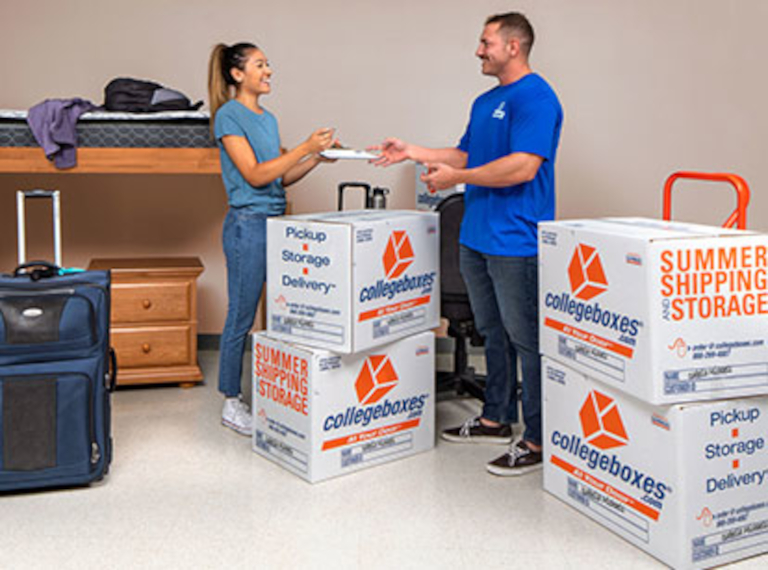 Parent and student unpacking in dorm room