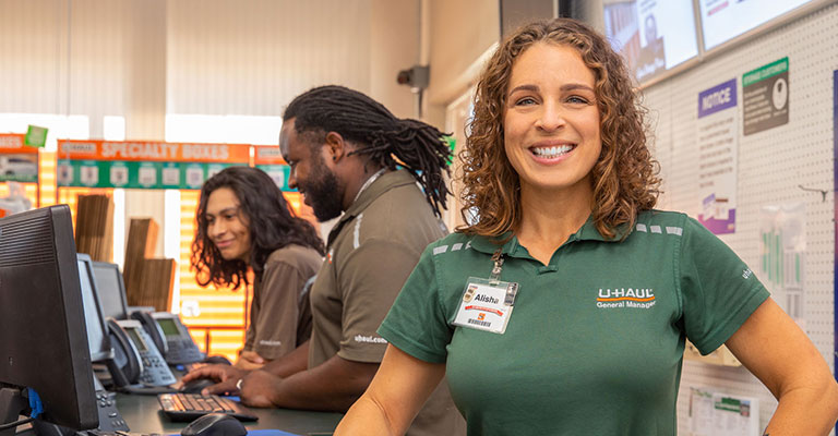 U-Haul employees helping customers