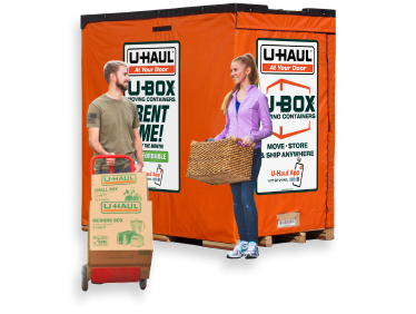 Military couple loading a U-Box moving container