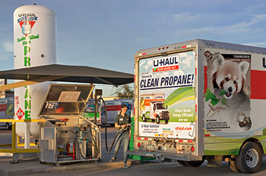Woman refilling at a U-Haul propane refill station