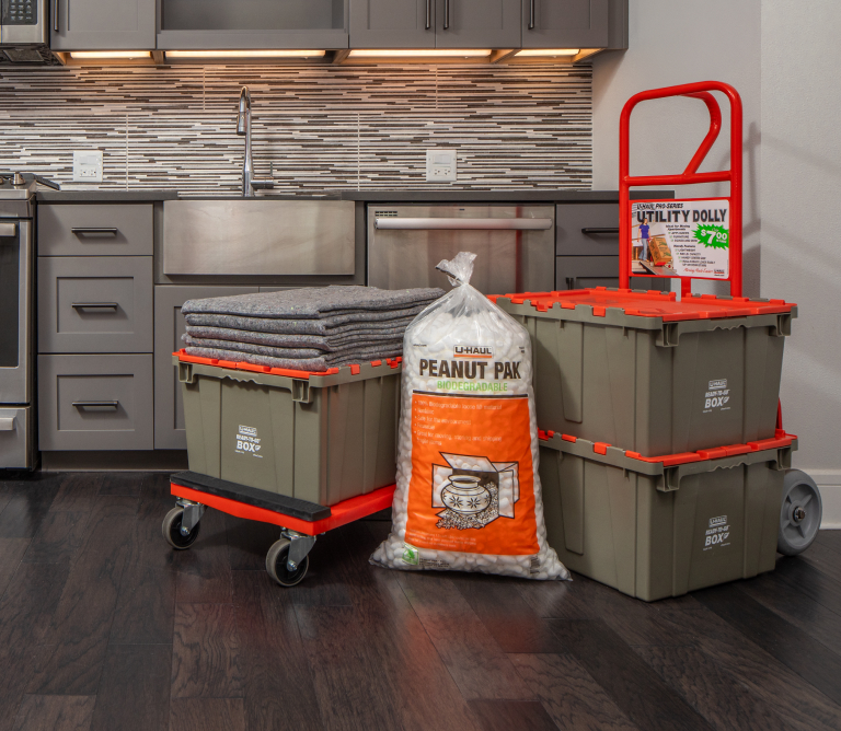Couple Unpacking Ready-To-Go Boxes