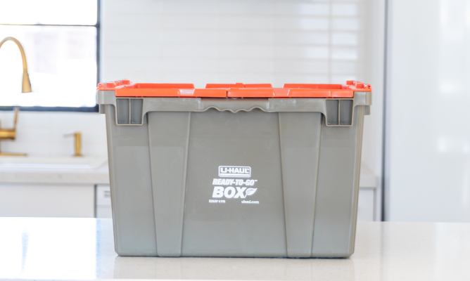 Couple Unpacking Ready-To-Go Boxes