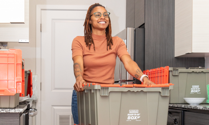 Couple Unpacking Ready-To-Go Boxes