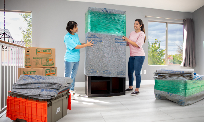 Couple Unpacking Ready-To-Go Boxes