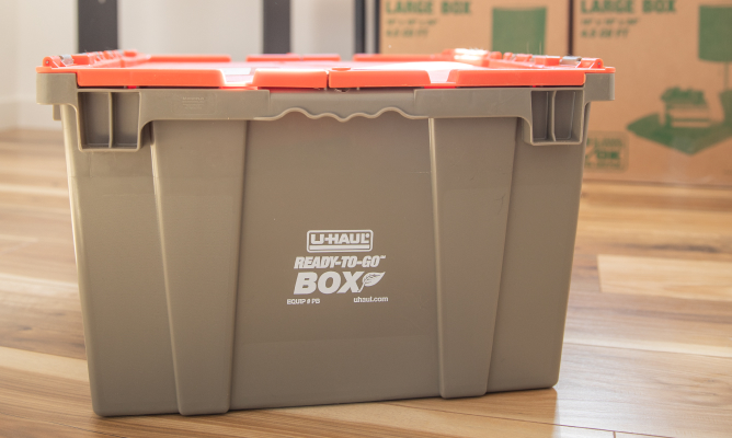 Couple Unpacking Ready-To-Go Boxes