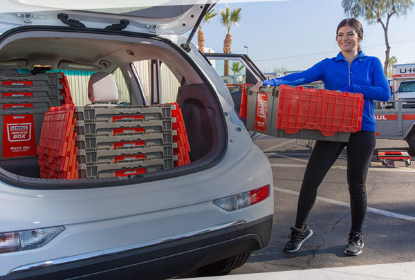 Woman Unpacking Ready-To-Go Boxes