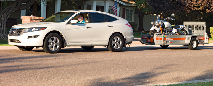 Car towing U-Haul trailer