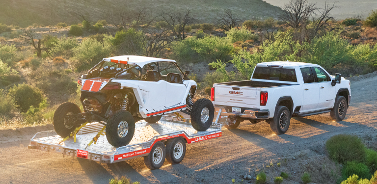 U-Haul truck with auto-transport trailer