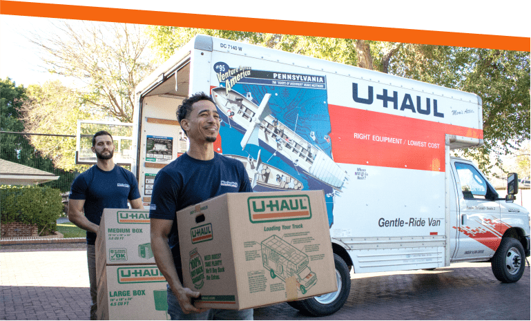 U-Haul Moving Helpers unloading moving boxes from a U-haul Truck