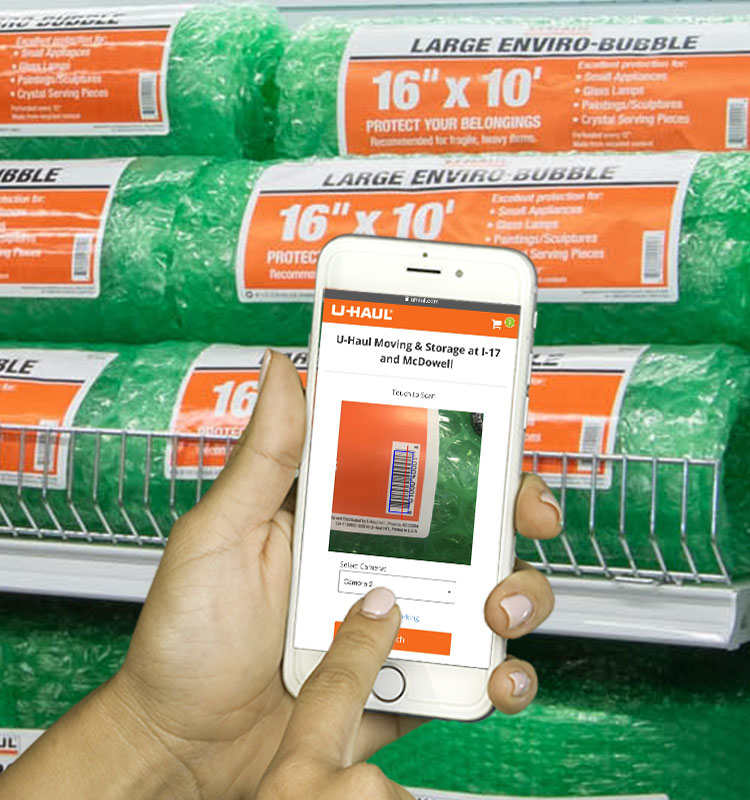 Smart phone in front of moving supplies