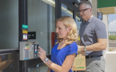 Woman swiping a credit card