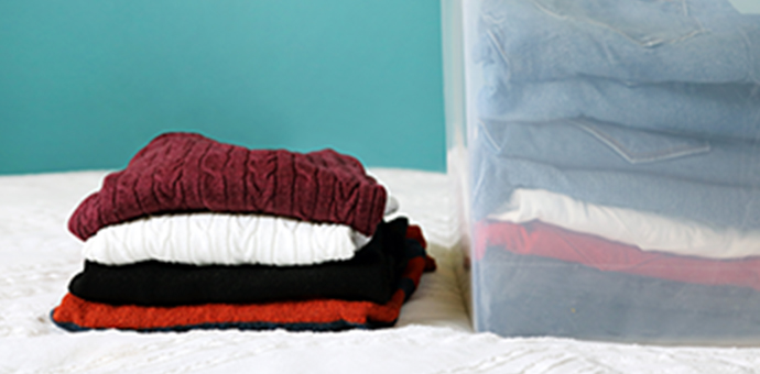 Folded cloths on bed