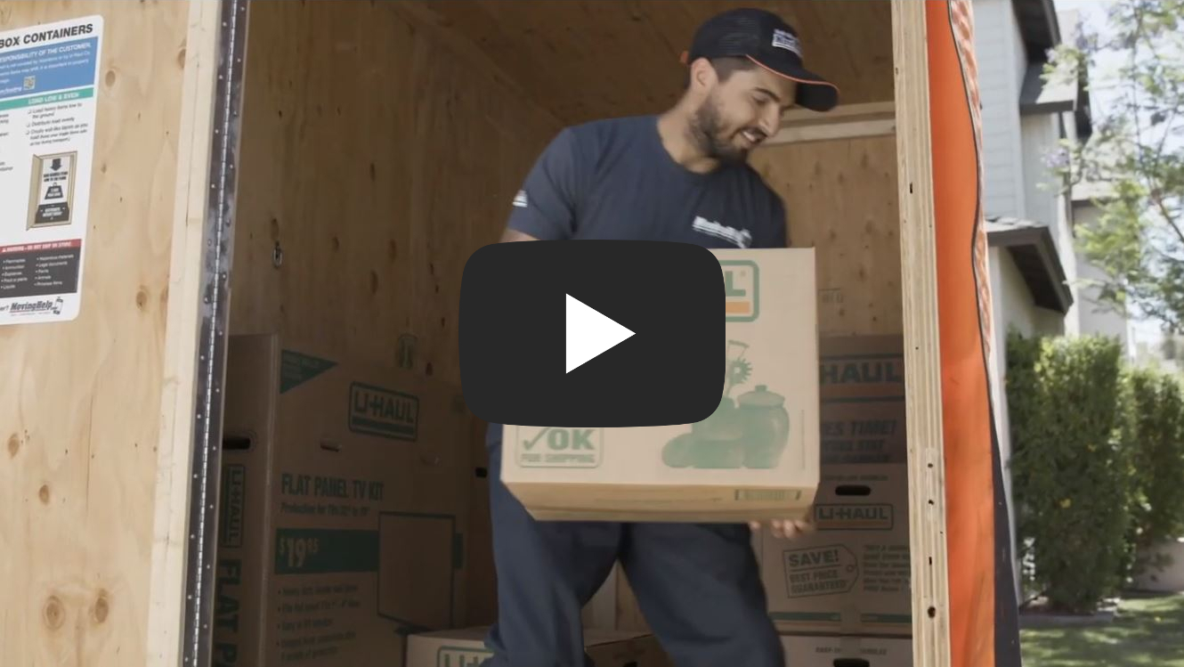 Man loading a box into a UBox