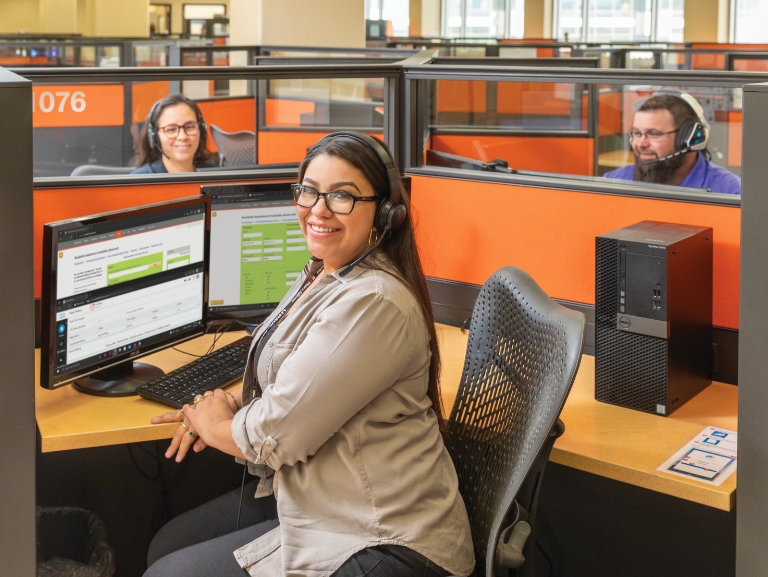 3 members of the Invoicing Team at their work stations