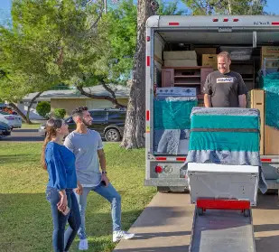 Moving Helpers loading a U-Haul truck