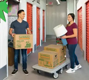 Couple loading their U-Haul storage room